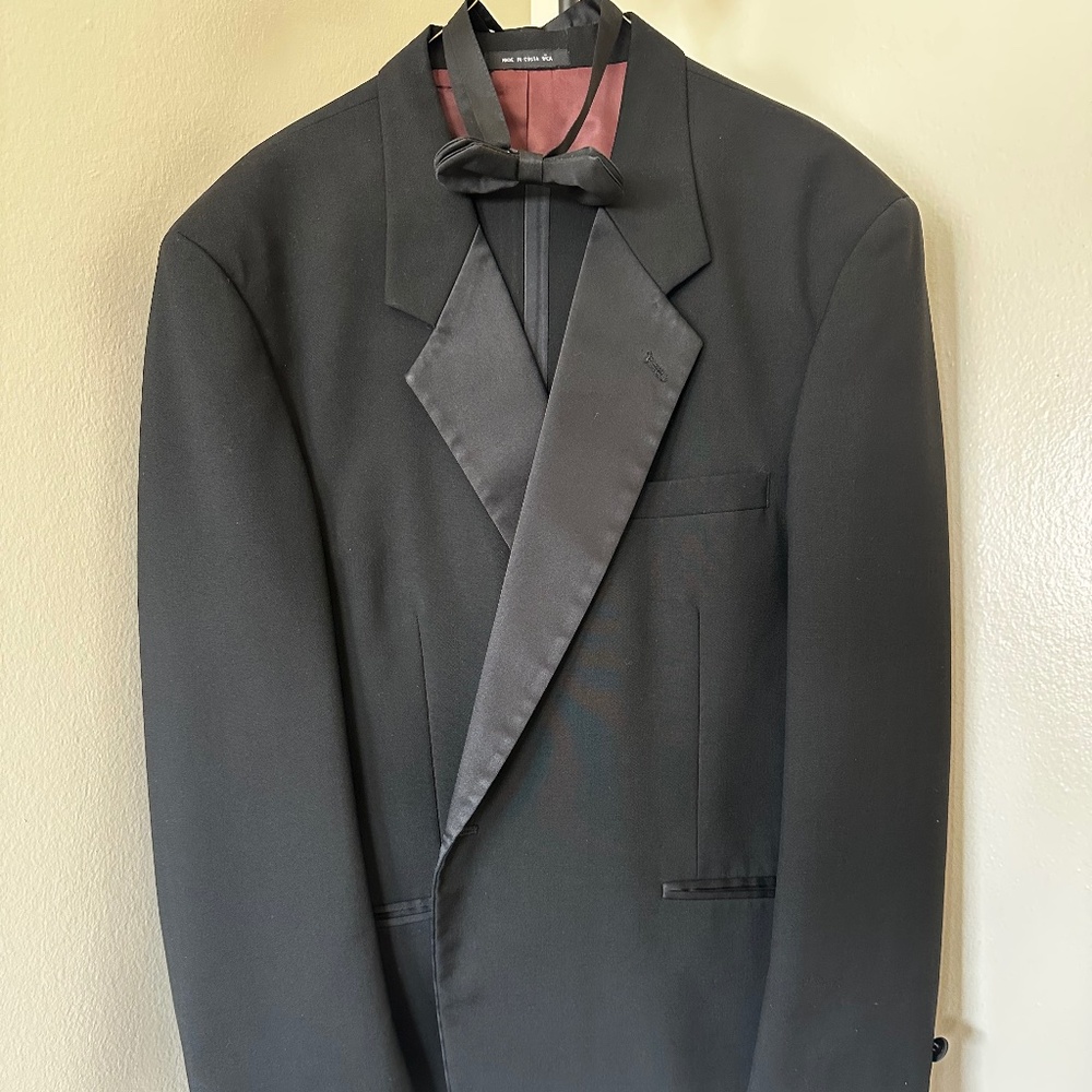 Tuxedo with pants, vest and bow tie.